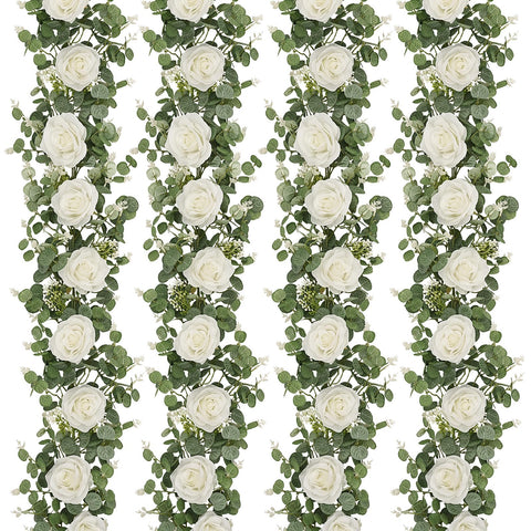 Dolicer eucalyptus garland with white roses for wedding decor.