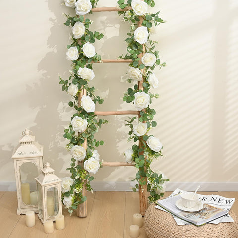 Dolicer wedding backdrop garland with eucalyptus and roses.