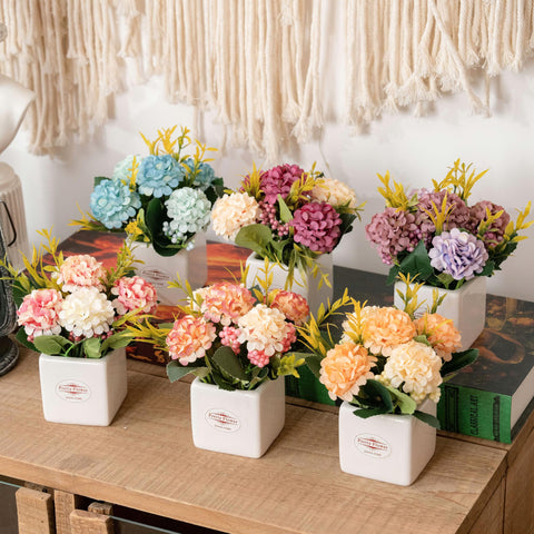 Donmills office desktop floral arrangement adds subtle greenery.