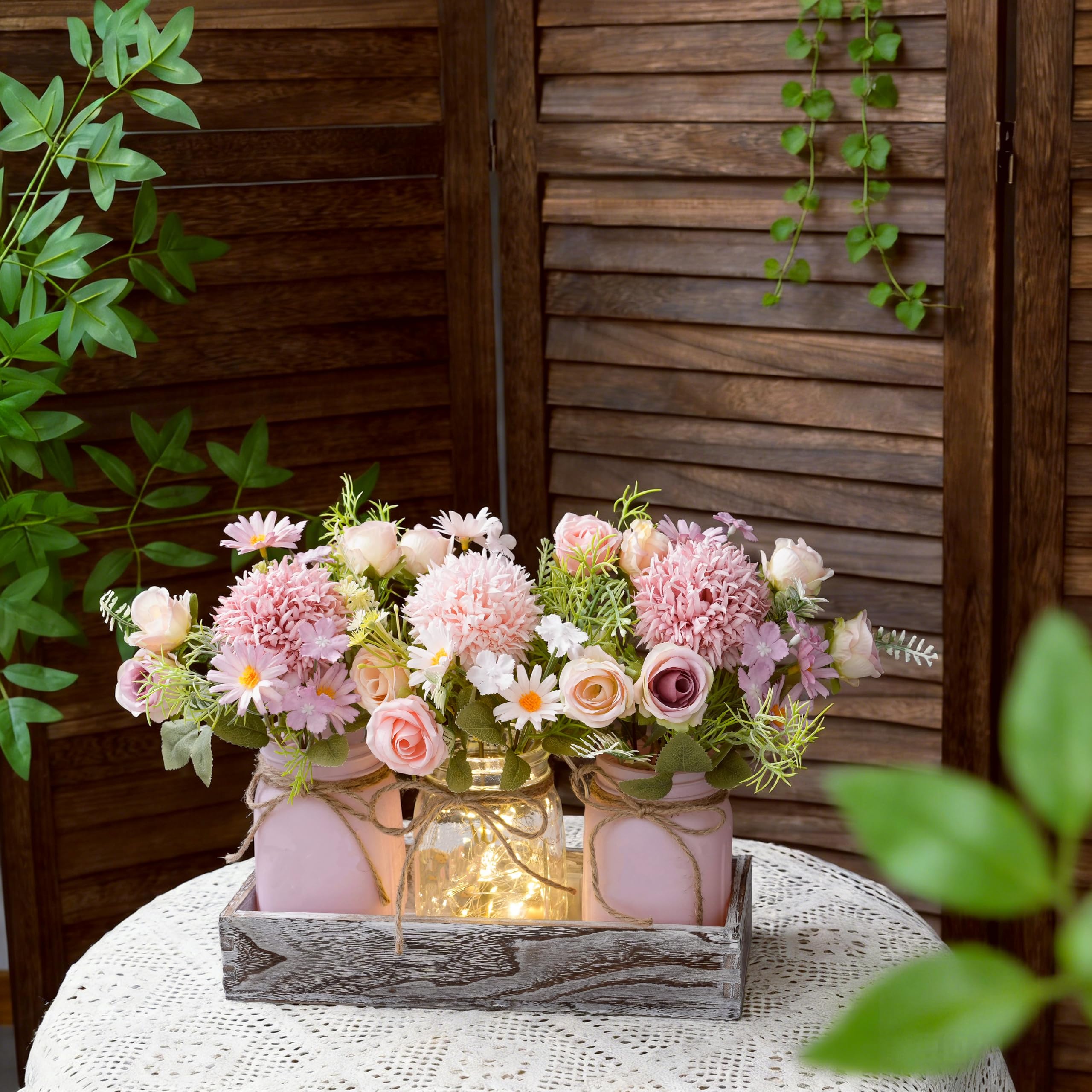 Wood tray with mason jars featuring pink and purple flowers for spring decor