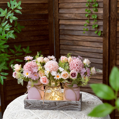 Wood tray with mason jars featuring pink and purple flowers for spring decor