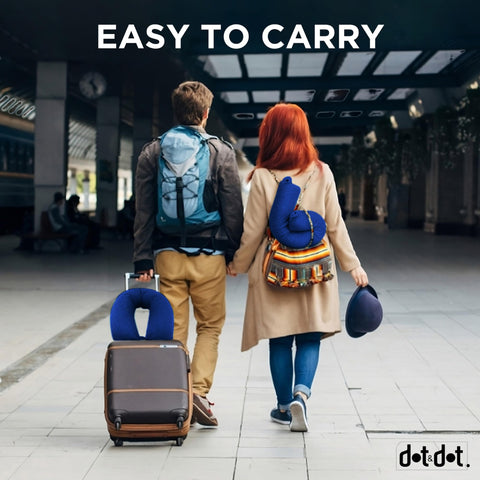 Dot&Dot travel pillow attached to carry-on, ready for travel convenience.