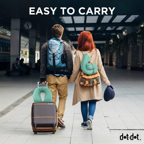 Dot&Dot Twist pillow with snap closure attaches to luggage for easy travel.