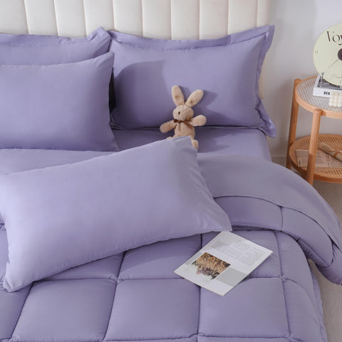 Downcool full-size comforter set in purple with even stitching for durable warmth.