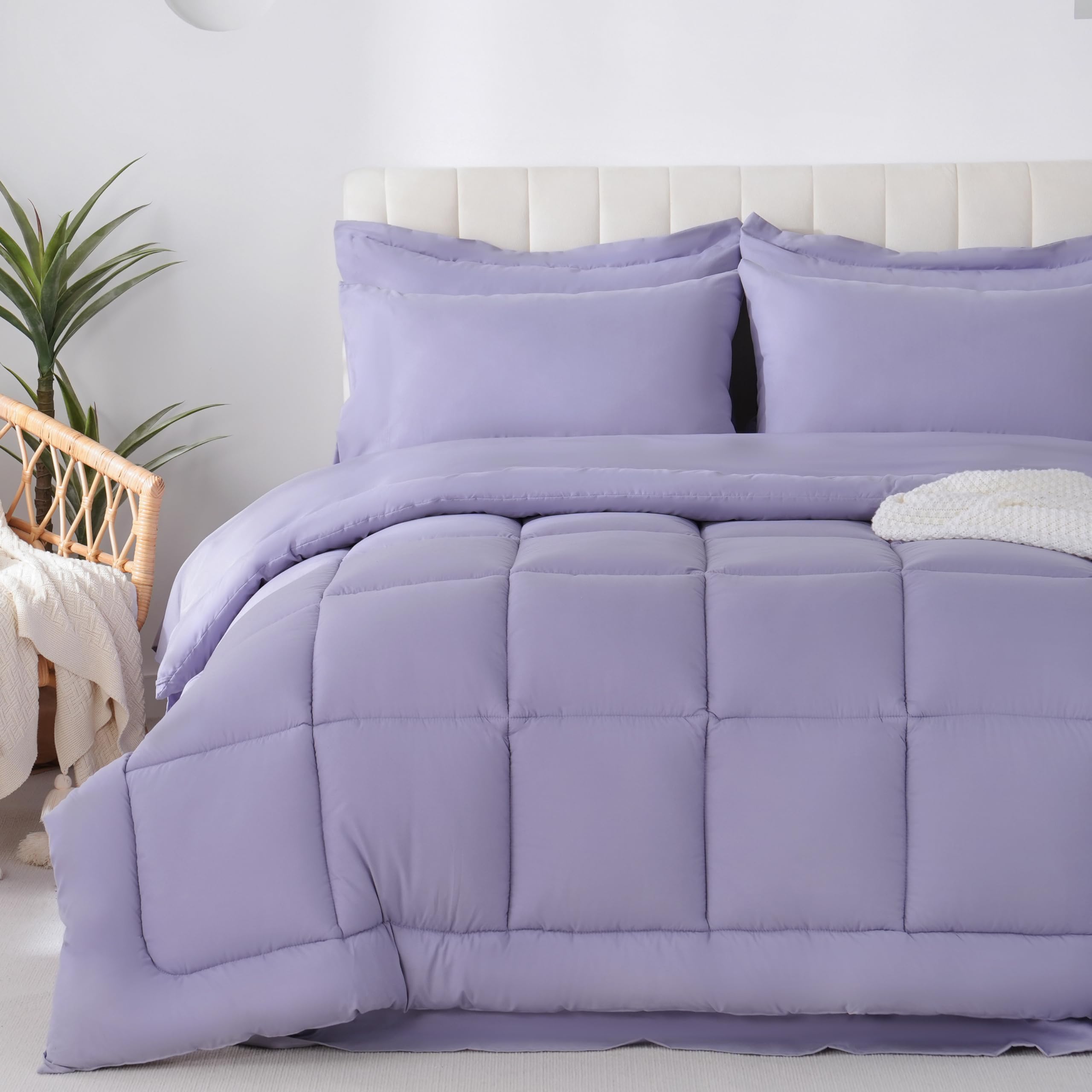 Downcool full-size comforter set includes flat sheet for all-season coziness.