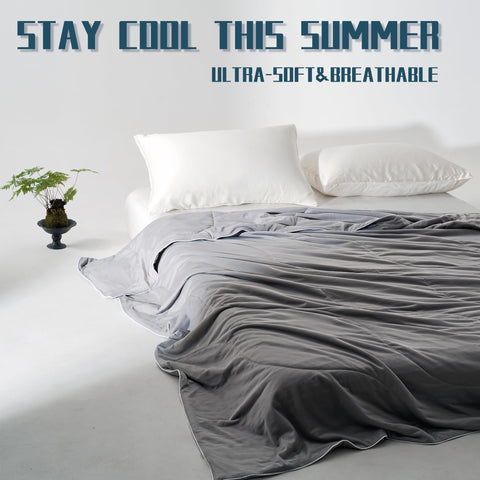 DOWNCOOL queen-size grey cooling blanket fits beds and loungers with versatility.