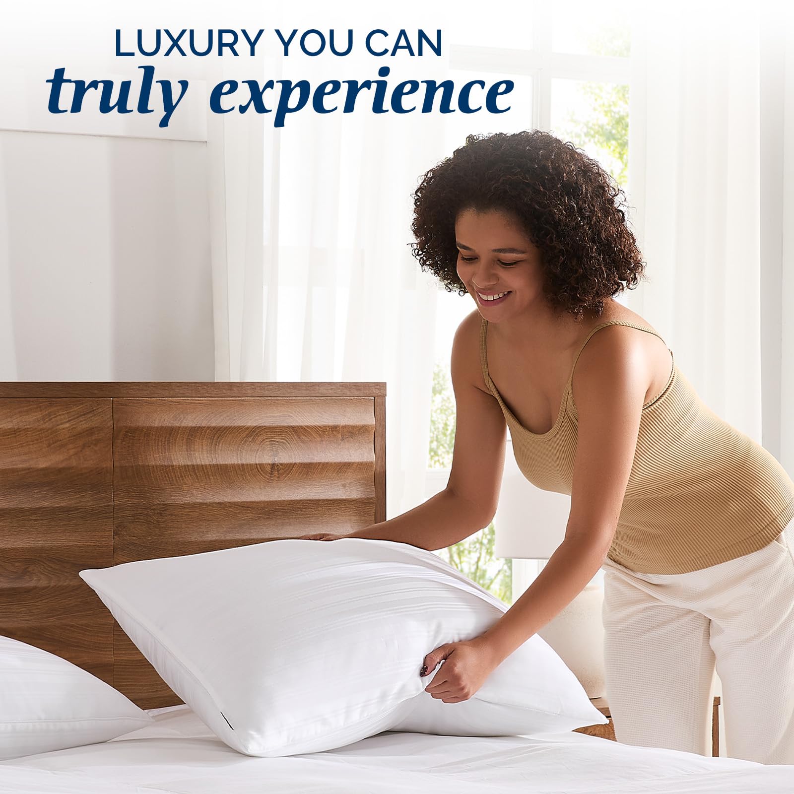 Two Downluxe goose feather pillows shown as a matching queen set.