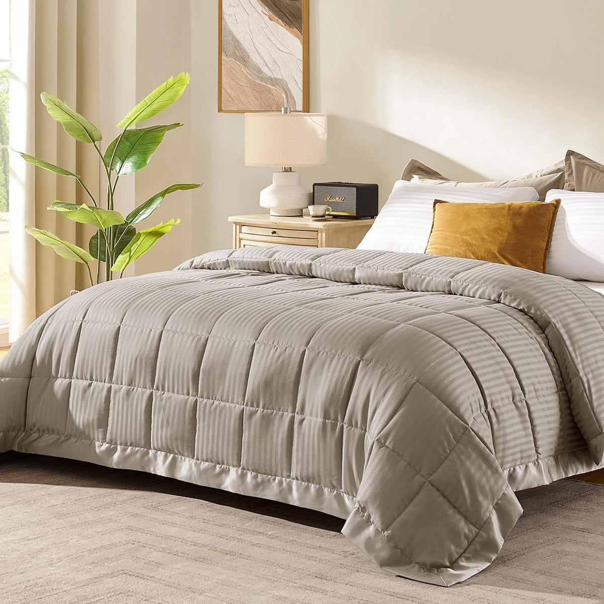 Downluxe king-size blanket in sand color folded for storage, soft texture