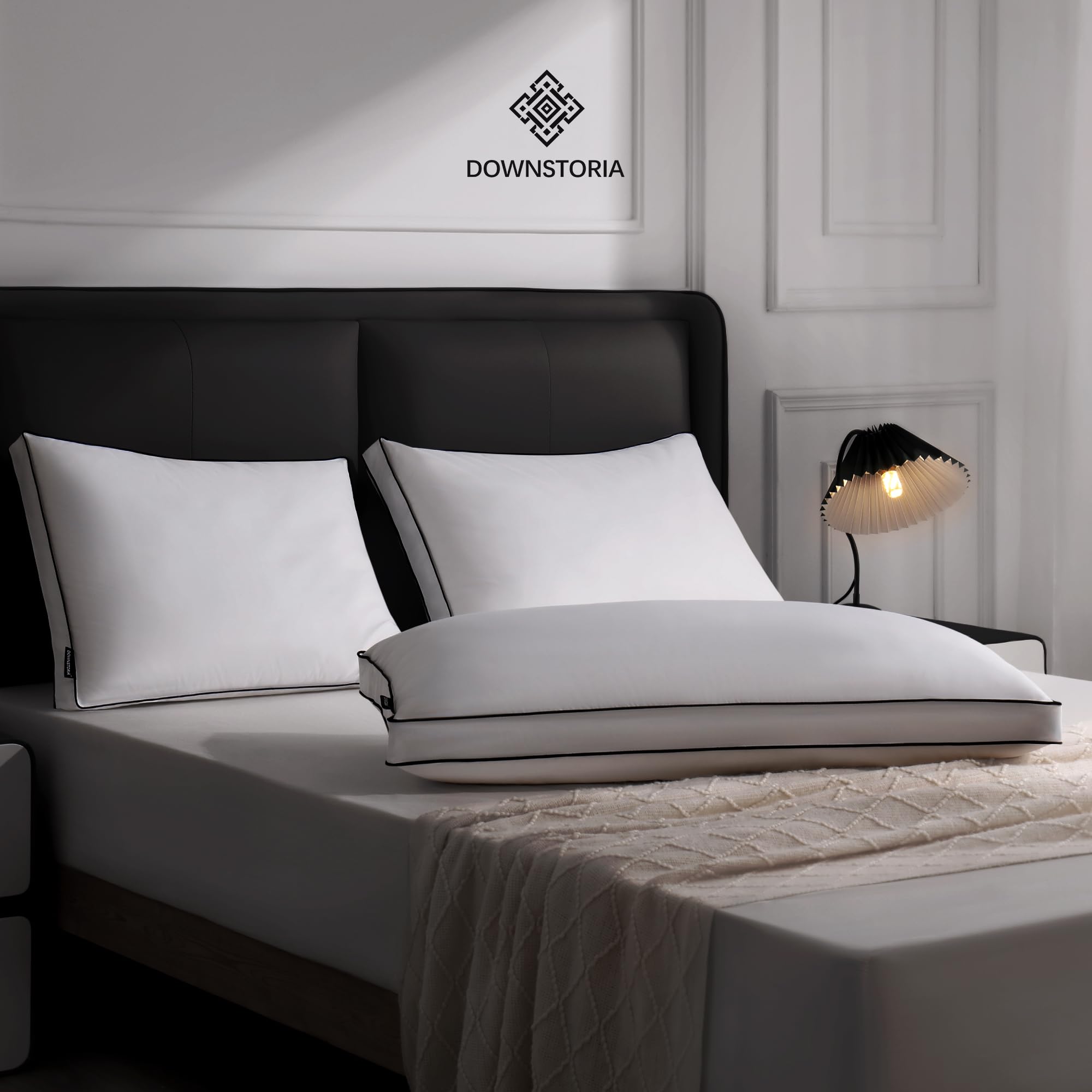 Downstoria bedroom setup with pillow on bed highlights cozy luxury for sleep