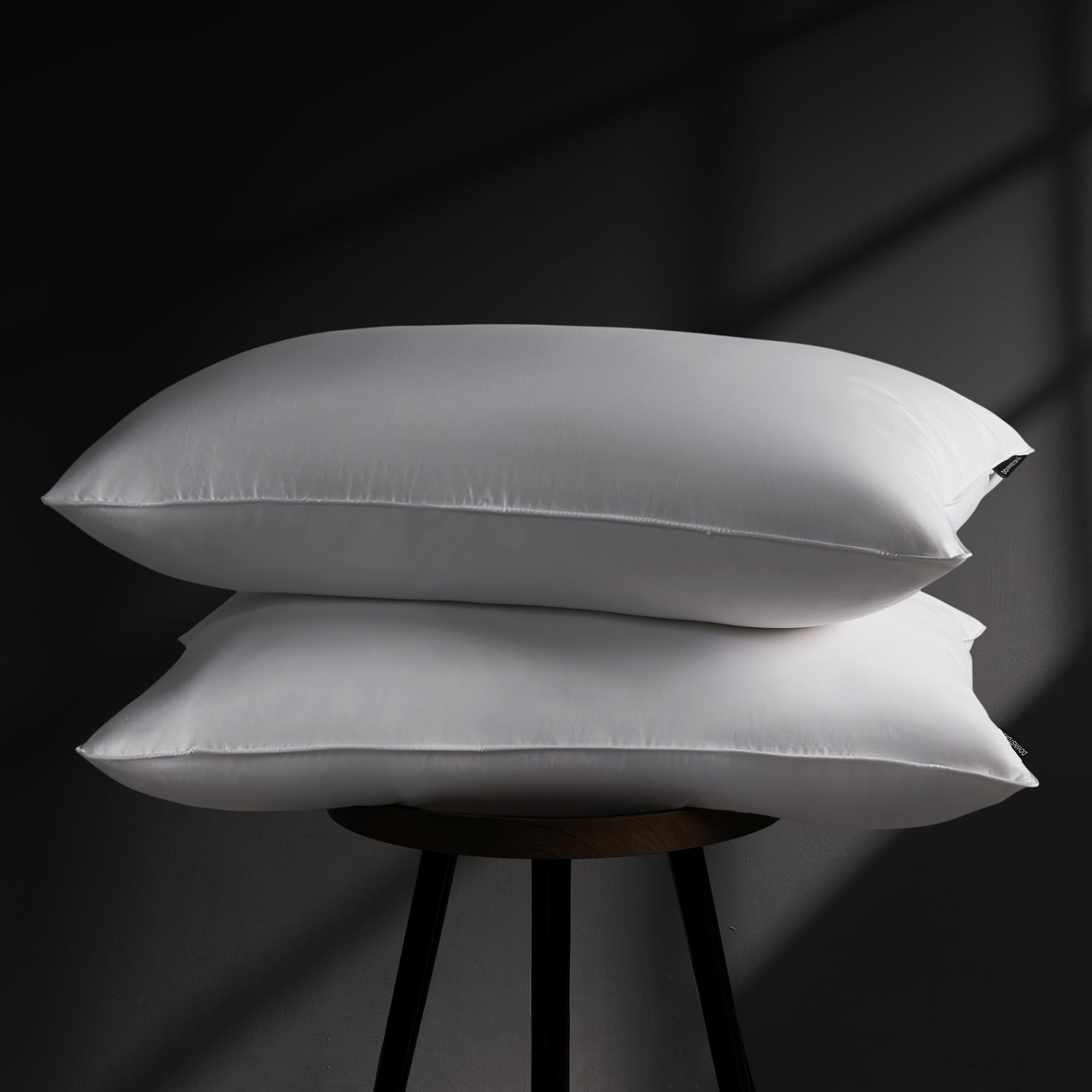 DOWNSTORIA goose-down pillow 2-pack packaging view for easy storage.