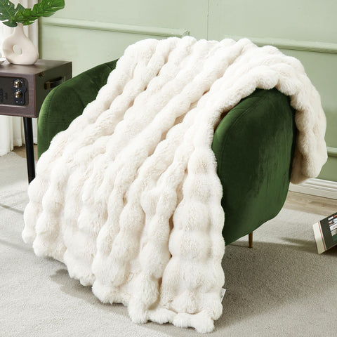 DREAMNINE blanket on a sofa to illustrate decorative warmth in a living room