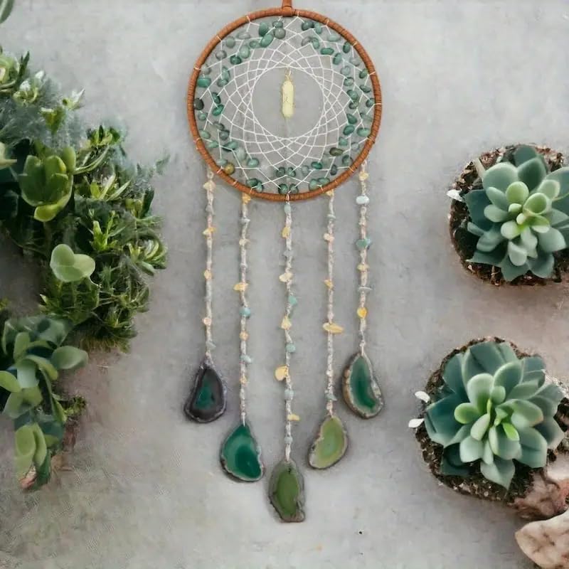 Dreamocean boho dream catcher with green turquoise crystals sparkling in a window