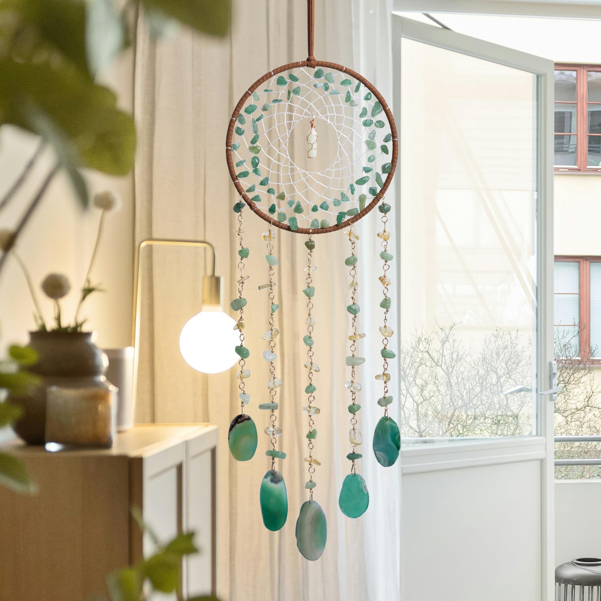 Dreamocean dream catcher hanging on wall in turquoise colors