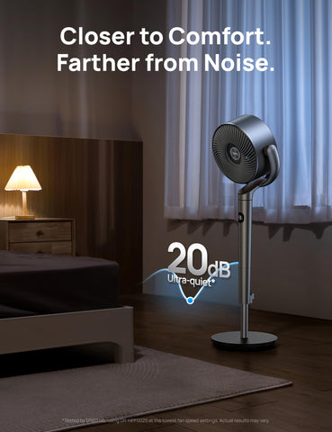 DREO standing fan in a bedroom/office setup for versatile cooling