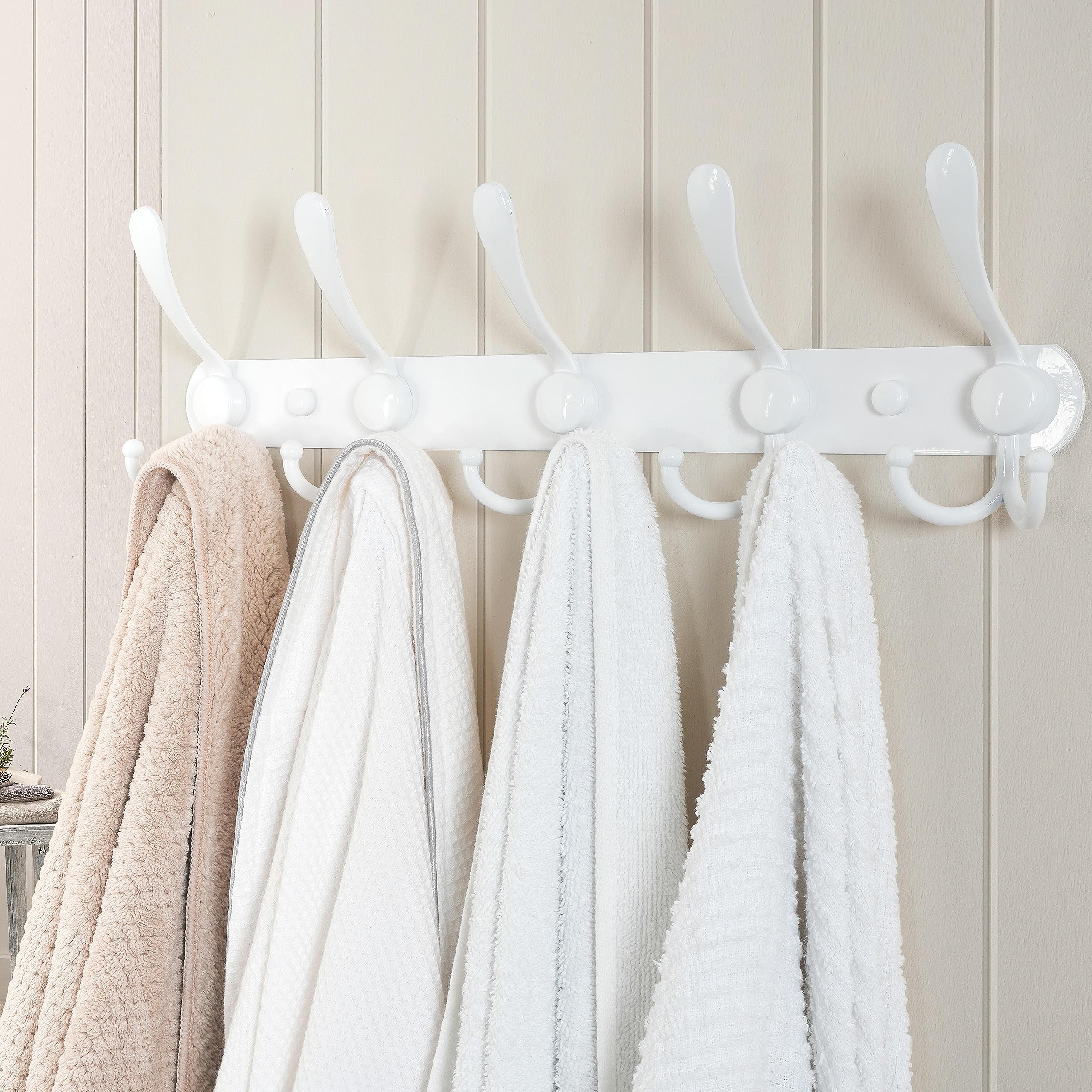 Dseap coat rack holds coats and hats in a tidy mudroom