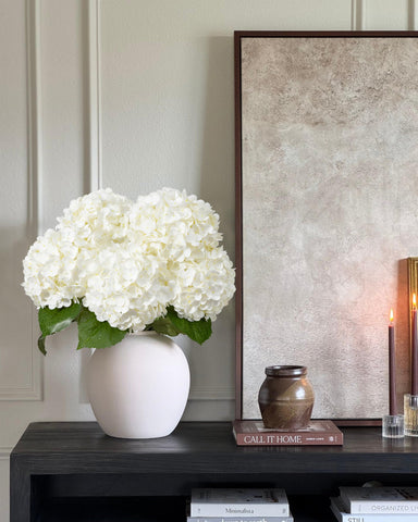 DuHouse white hydrangea centerpiece setup for weddings and refined spaces.