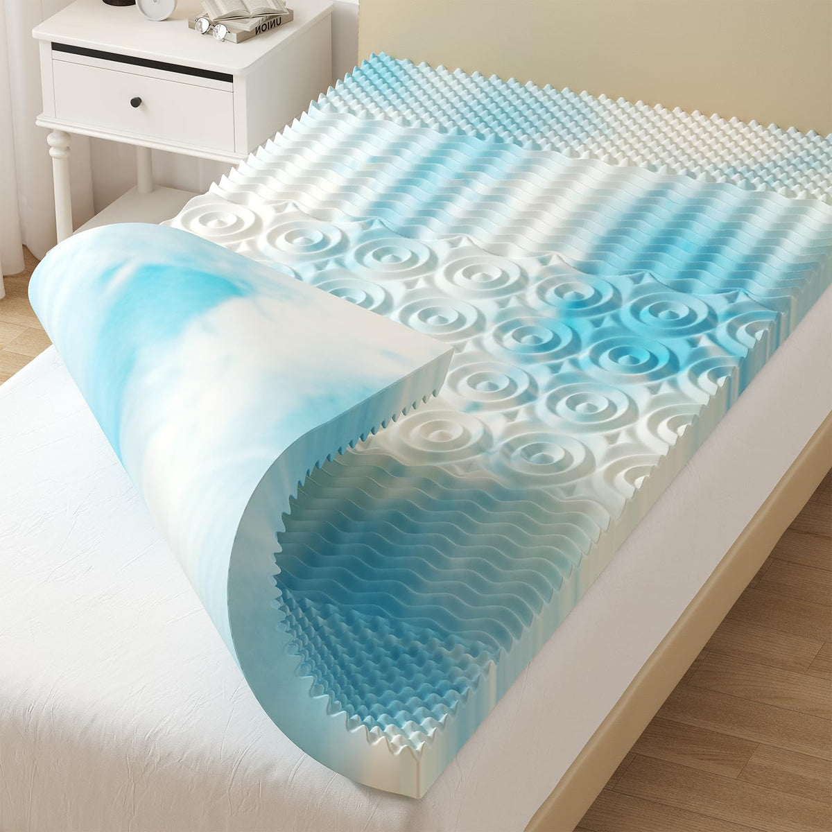 DUMOS 4-inch memory foam topper on a twin bed offering targeted pressure relief.