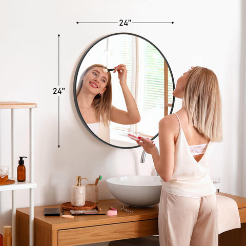 DUMOS brushed-frame round mirror with modern rust-resistant finish.