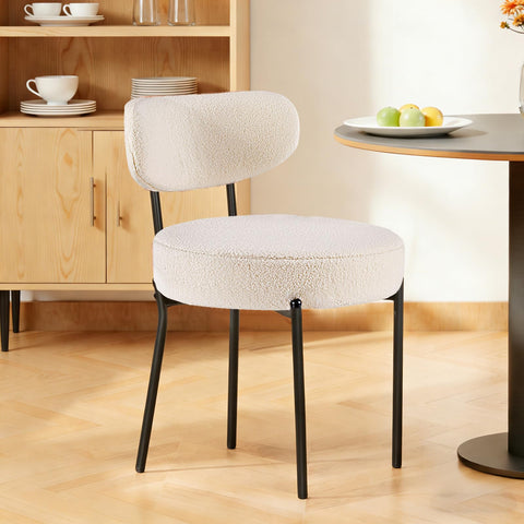DUMOS black metal legs contrast with light beige upholstery