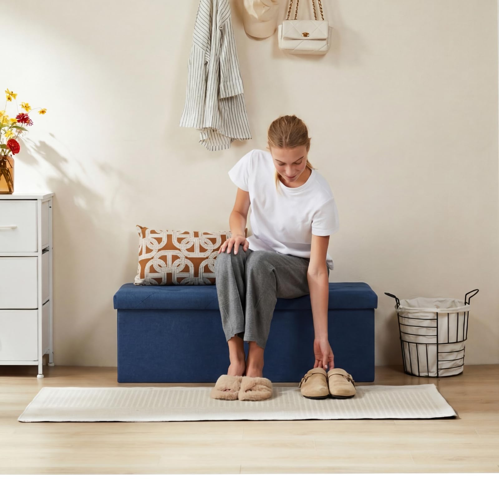 DUMOS foldable storage ottoman blue side view highlighting slim profile.