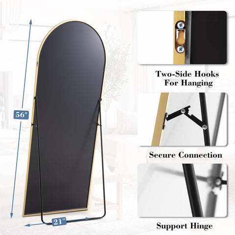 DUMOS gold-finish mirror adds an elegant focal point to a living space.