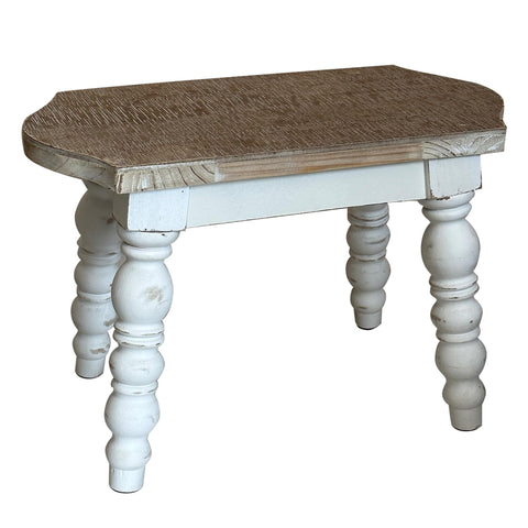 Dwellington bedside step stool in a bedroom with plant display.