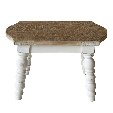 Dwellington wooden foot stool front view demonstrates compact, solid construction.