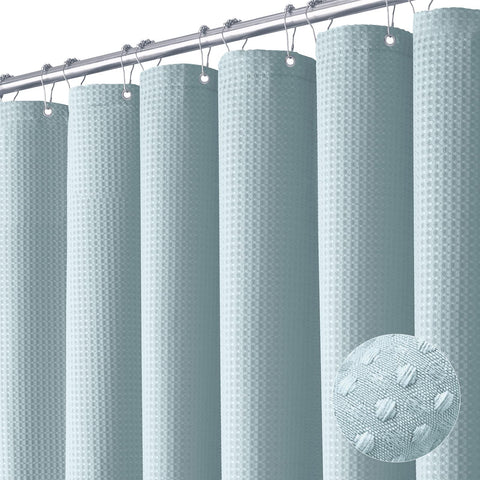 Dynamene fog blue curtain with waffle weave for durable privacy.