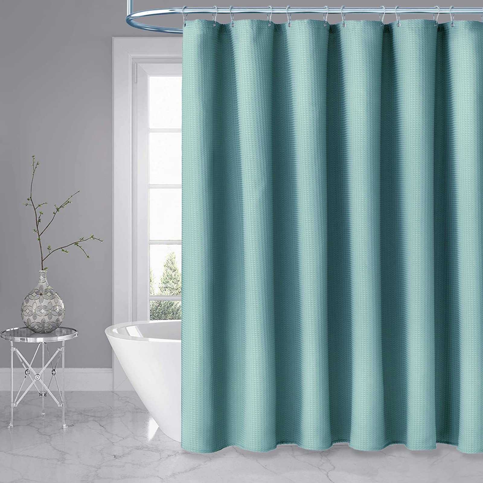 Dynamene teal spa-style curtain enhances a luxurious bathroom atmosphere
