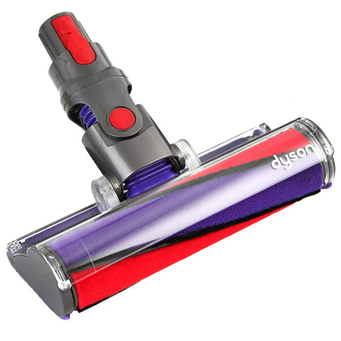 Dyson Soft Roller cleaner head in action on a hard floor, picking up fine dust