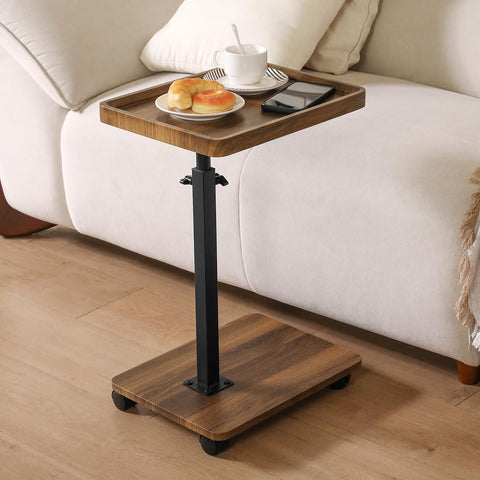 Eansstofars adjustable height couch table tucked under a sofa for easy access