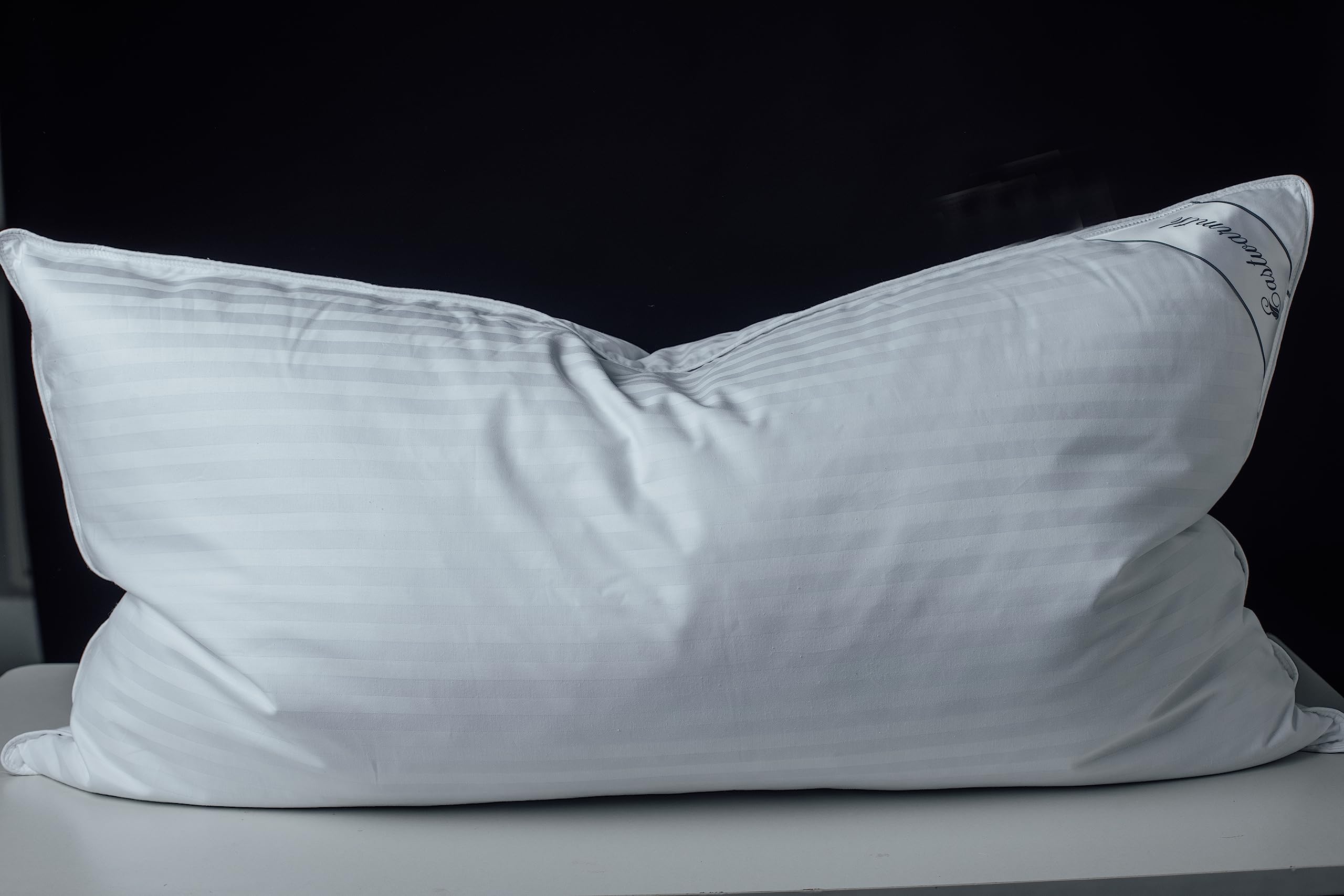Eastwarmth goose down pillow with cotton stripe cover for breathable comfort.