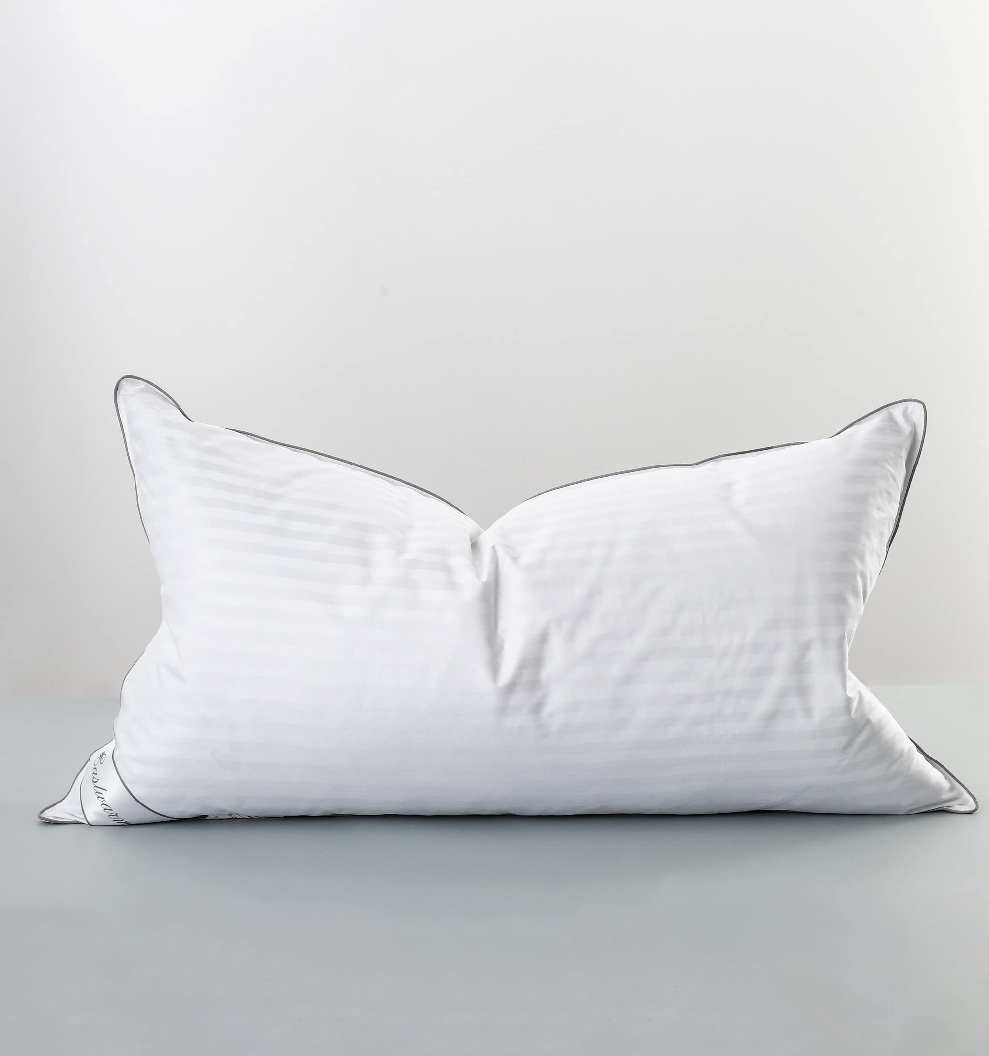 Eastwarmth goose feather down pillow front view with stripe cover, offering balanced support and breathable comfort.