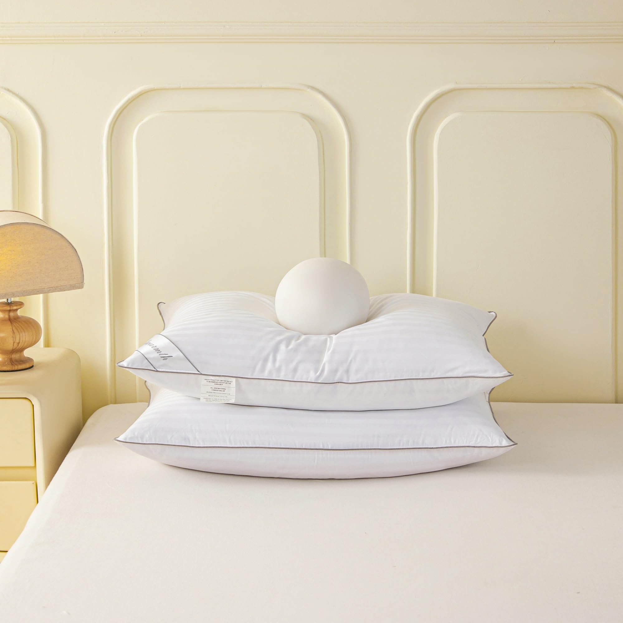 Eastwarmth pillow side view showing plush loft and stitch lines for durability.
