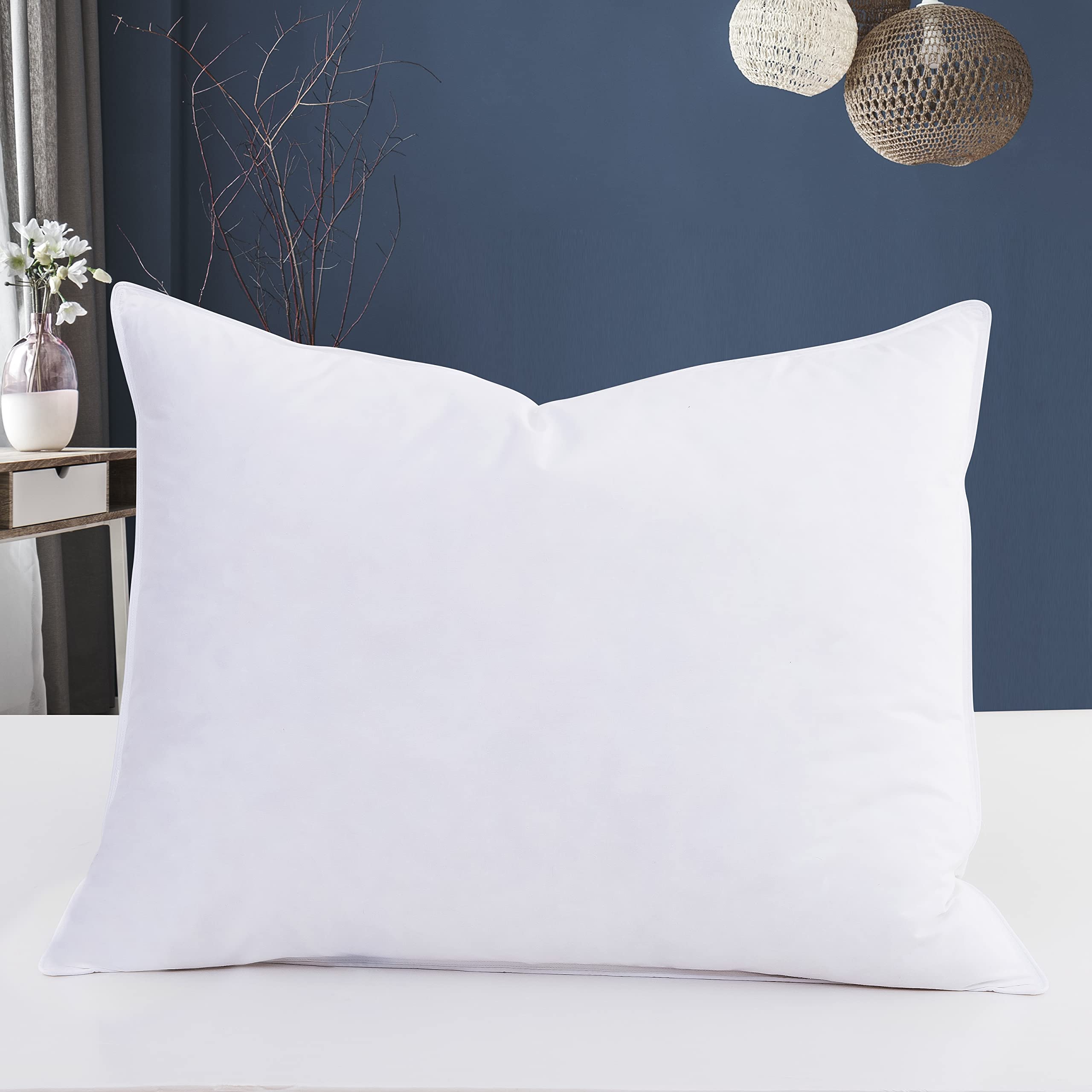 Eastwarmth pillow close-up reveals down and feather filling for breathable comfort.