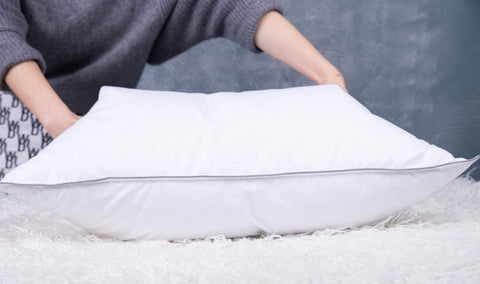 Eastwarmth vacuum-packed pillows illustrate easy shipping.