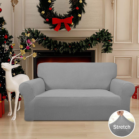 Easy-Going loveseat slipcover with elastic bottom anchors for secure fit.