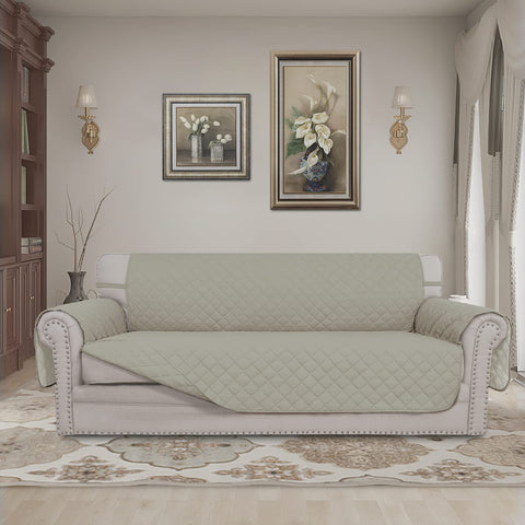 Easy-Going beige reversible couch cover with foam pipes helps it stay in place.