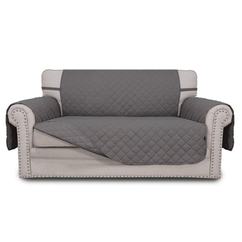 Easy-Going reversible loveseat cover with quilted fabric detail protects furniture from spills