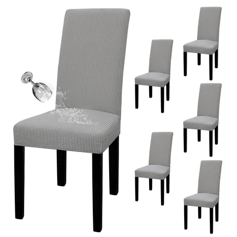 Easy-Going waterproof parson chair slipcover in light gray protecting dining chairs from spills