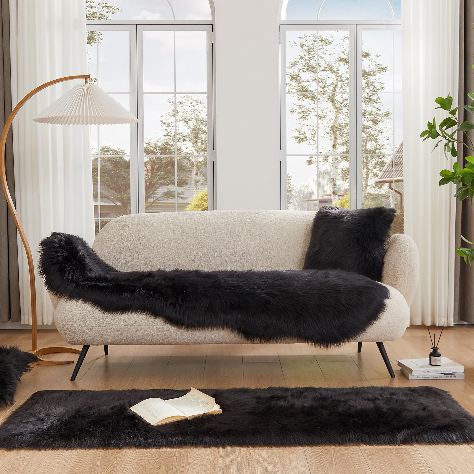 EasyJoy furry rug in living room creates contrast against dark floors.