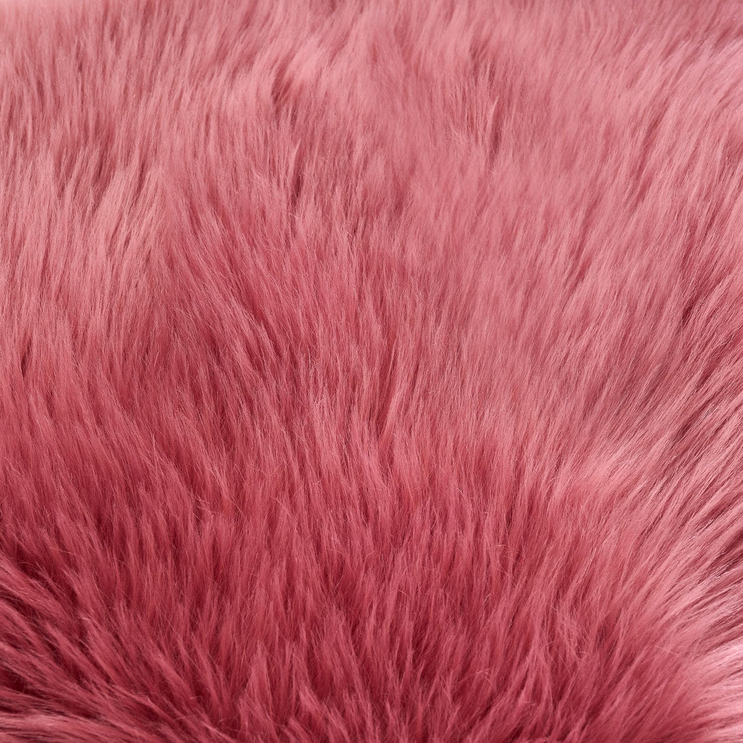 EasyJoy Ultra Soft Fluffy Sheepskin Rug blush pink color enhances cozy bedrooms.