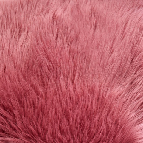 EasyJoy Ultra Soft Fluffy Sheepskin Rug blush pink color enhances cozy bedrooms.