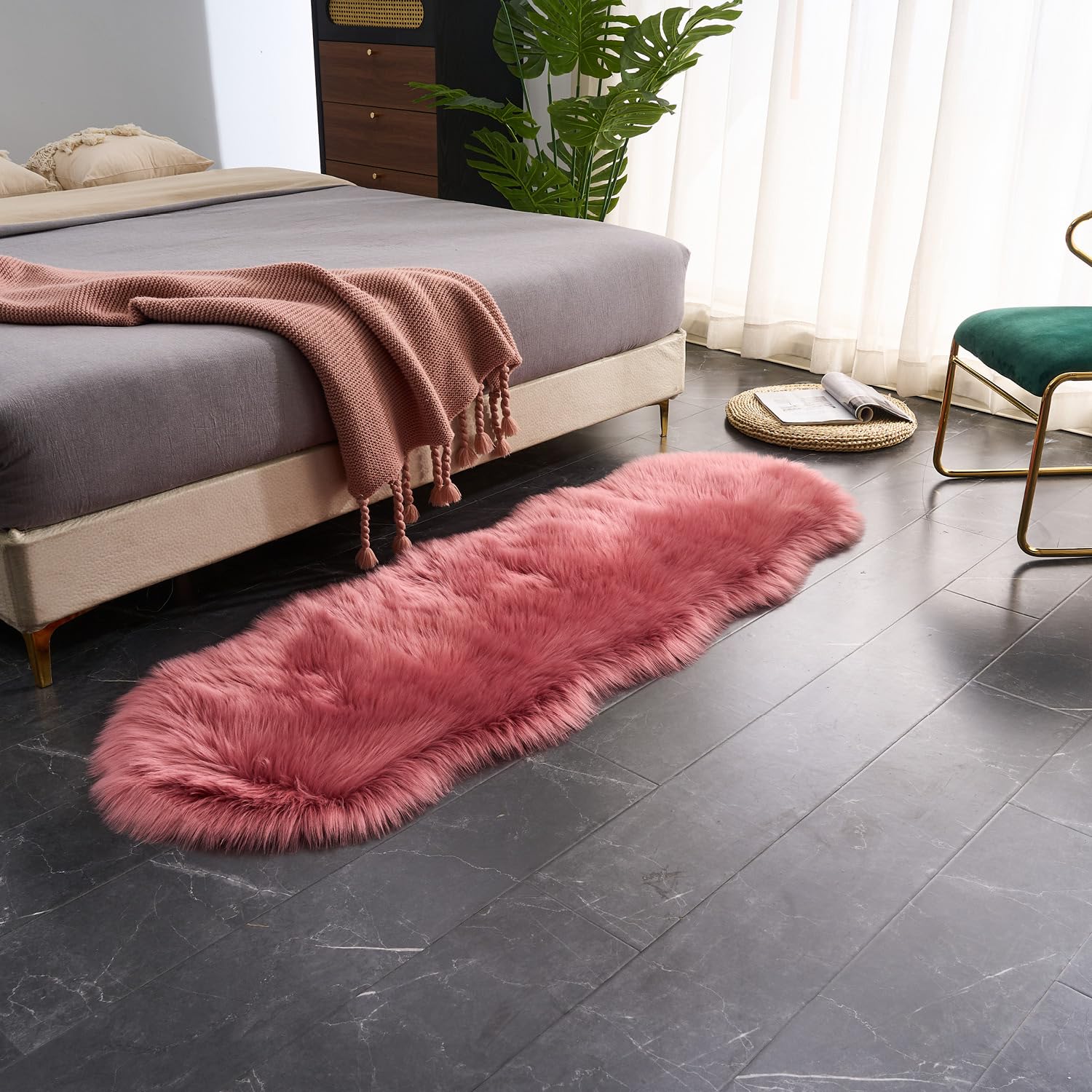 EasyJoy Ultra Soft Fluffy Sheepskin Rug non-slip back for safe placement on wood floors.