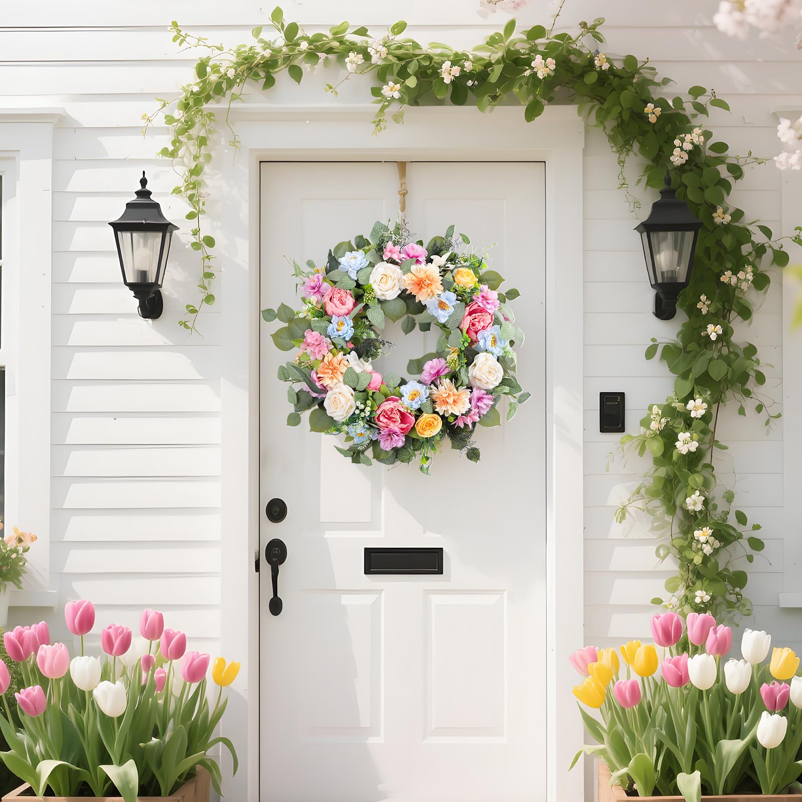 Ecerangus summer wreath with peony, rose and dahlia in lush arrangement.