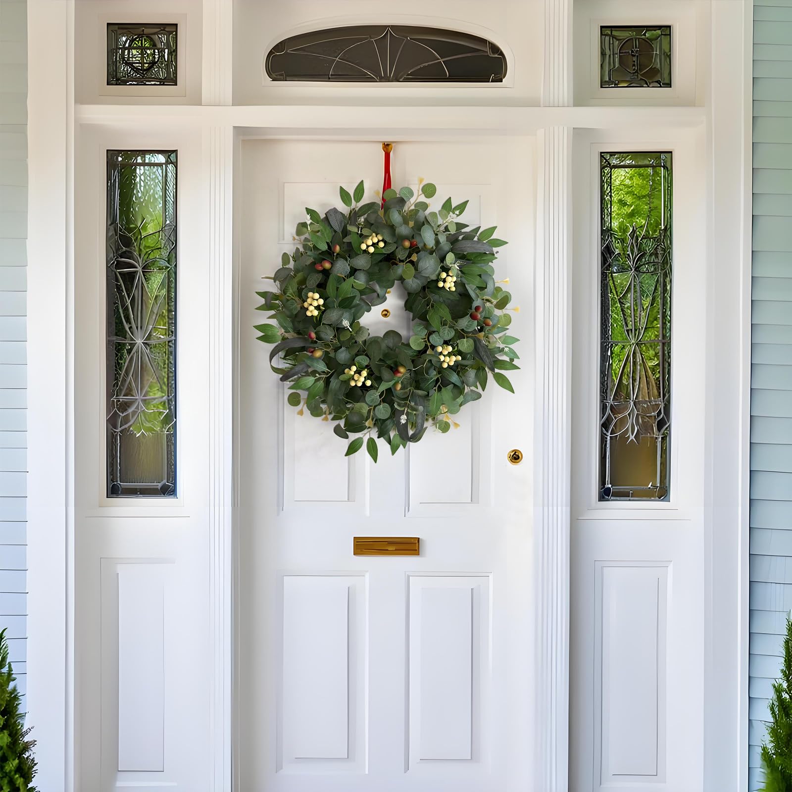 Ecerangus wreath close-up shows white berries and olives detail for seasonal charm