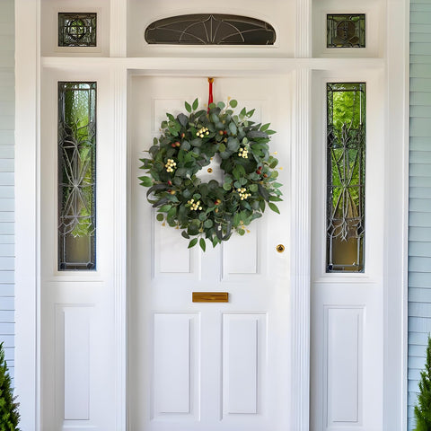 Ecerangus wreath close-up shows white berries and olives detail for seasonal charm