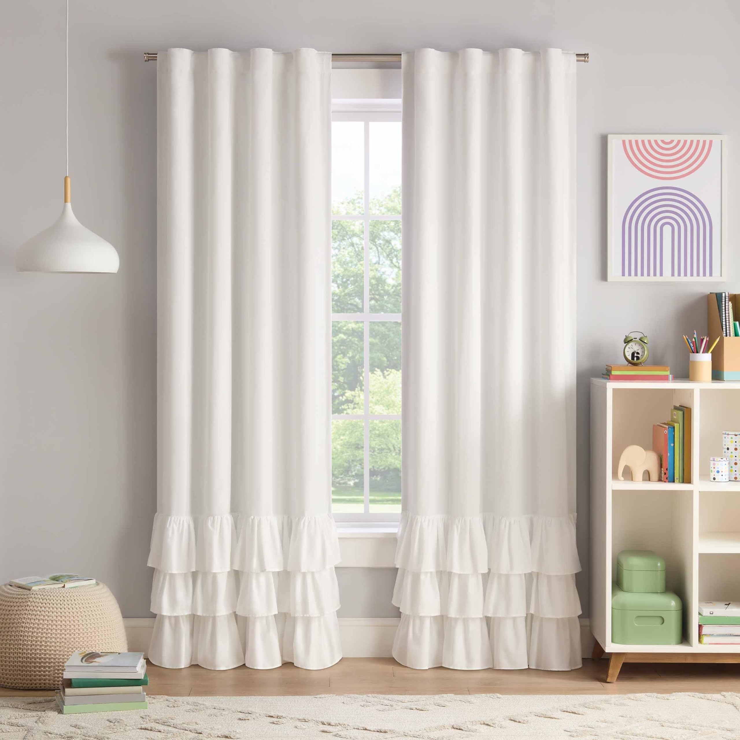 Eclipse Kids tiered ruffle Thermaback blackout curtain 84x40 in white, blocking light for restful naps.