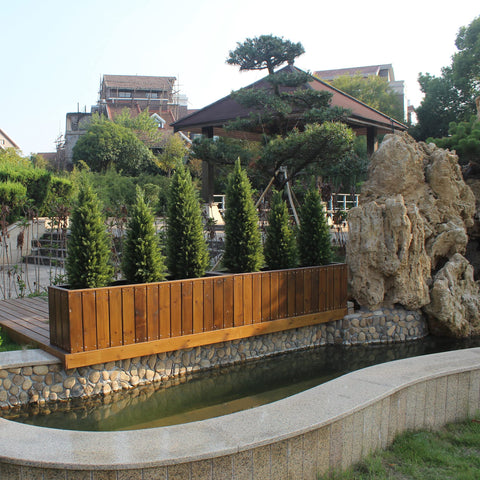 ECOLVANT artificial cedar leaves close-up highlights UV protection and color depth.