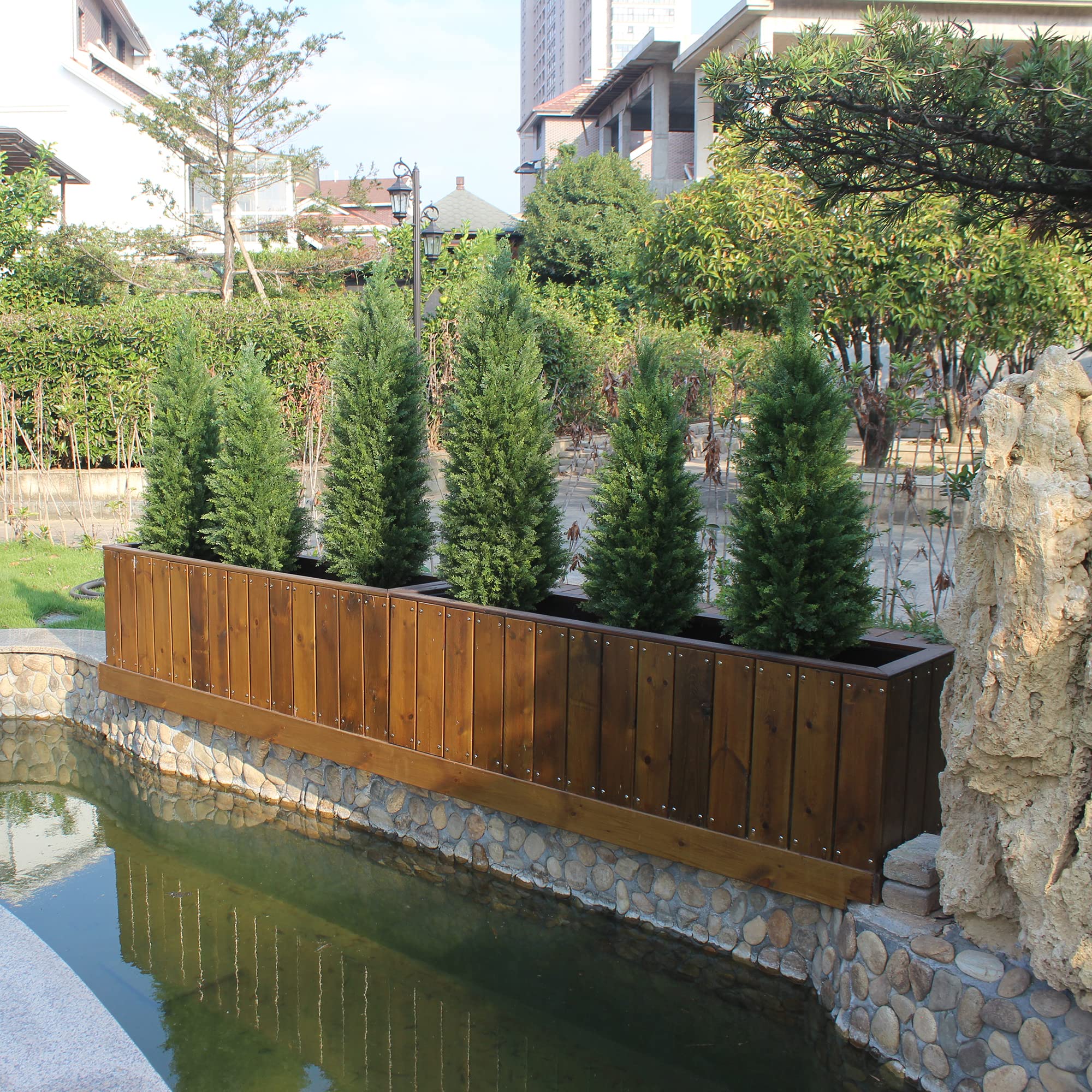 ECOLVANT cedar topiary placed neatly in a planter.